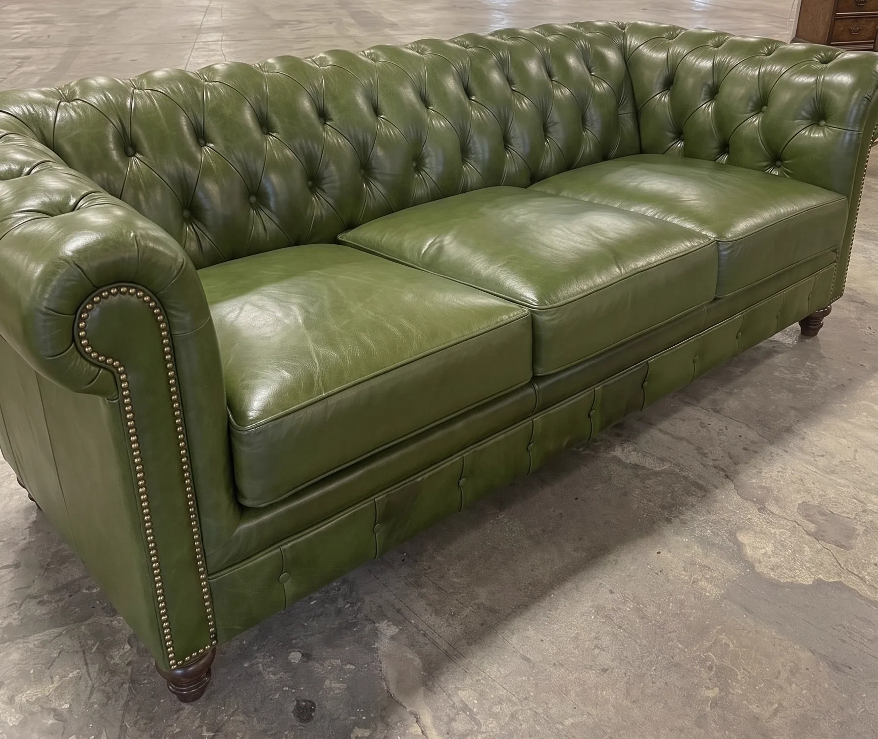 Dark-brown leather sofa after recolour and conditioning